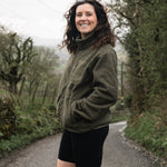 woman in khaki fleece and shorts