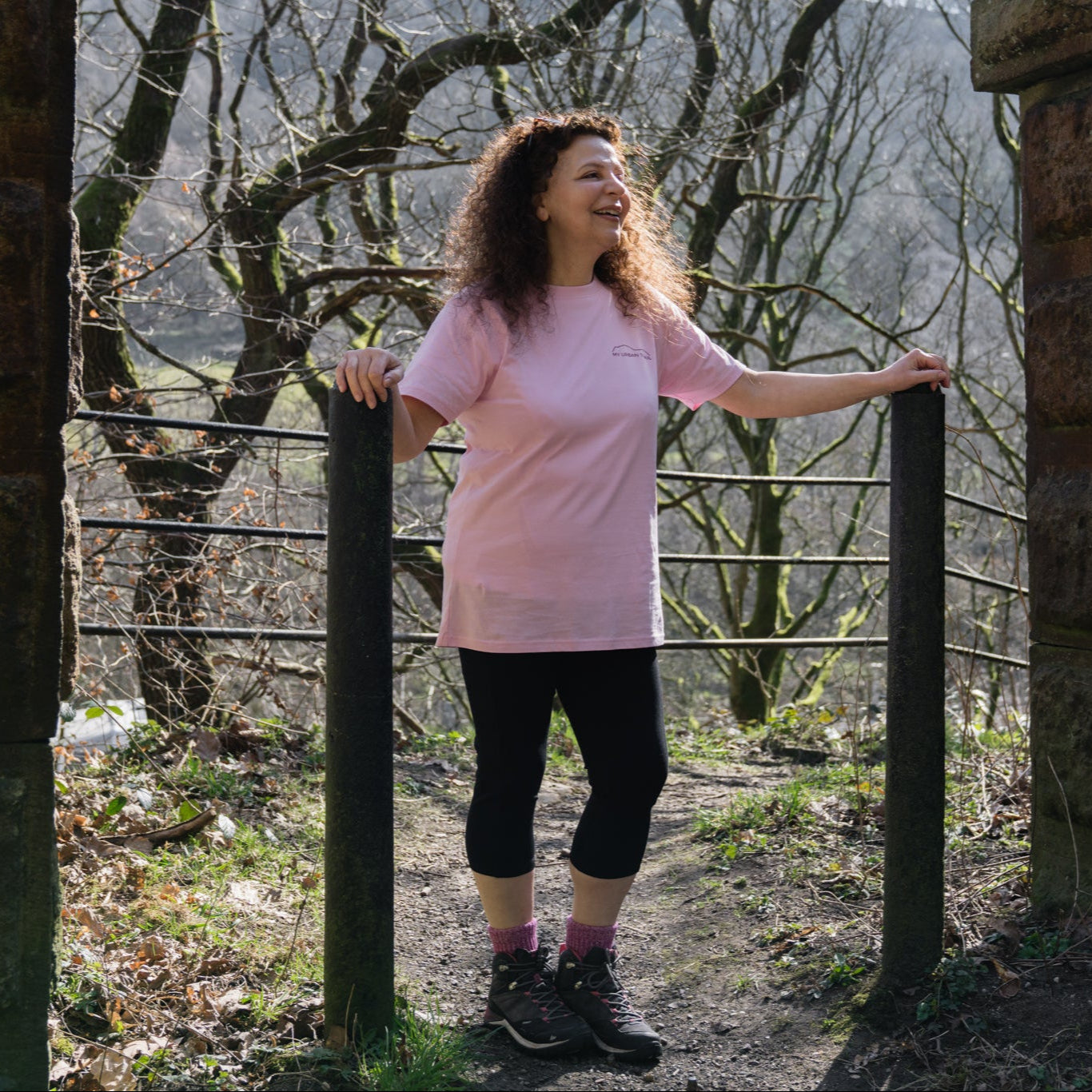woman in black capri leggings and pink T