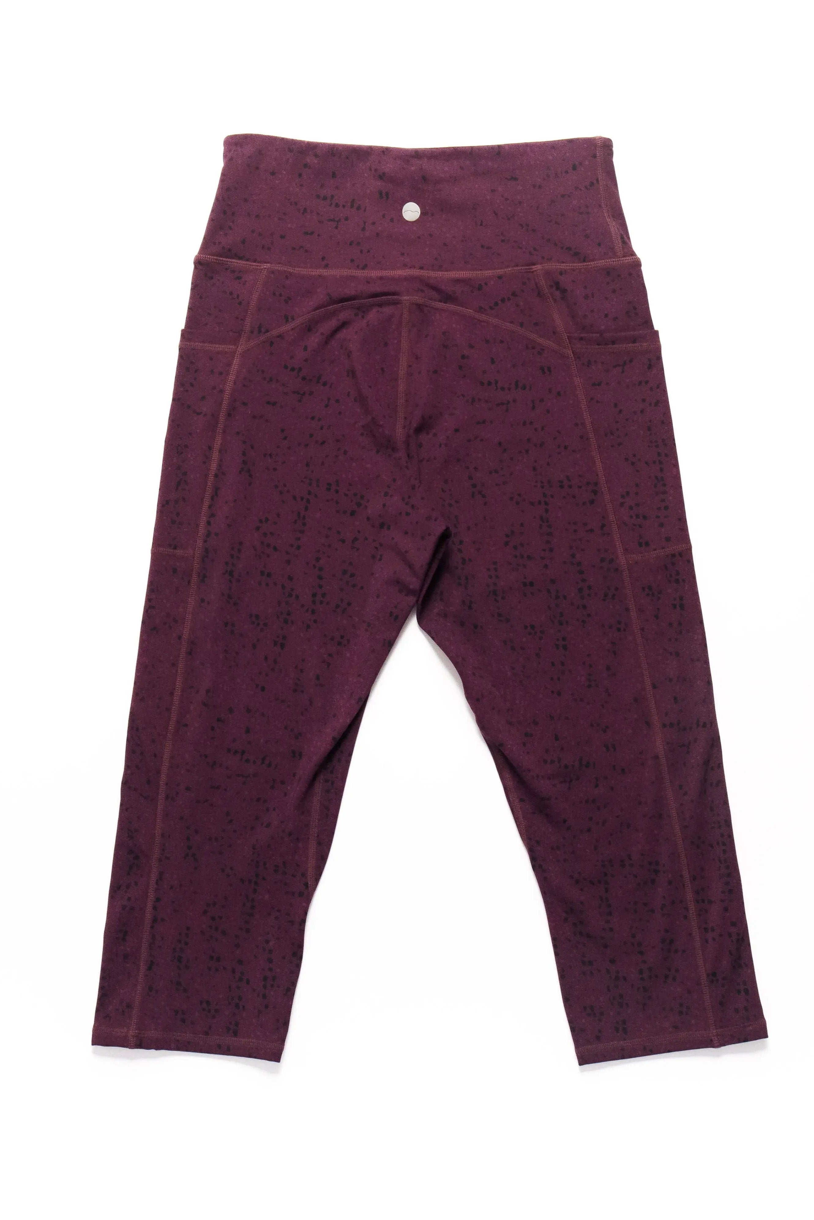 Maroon leggings on a white background