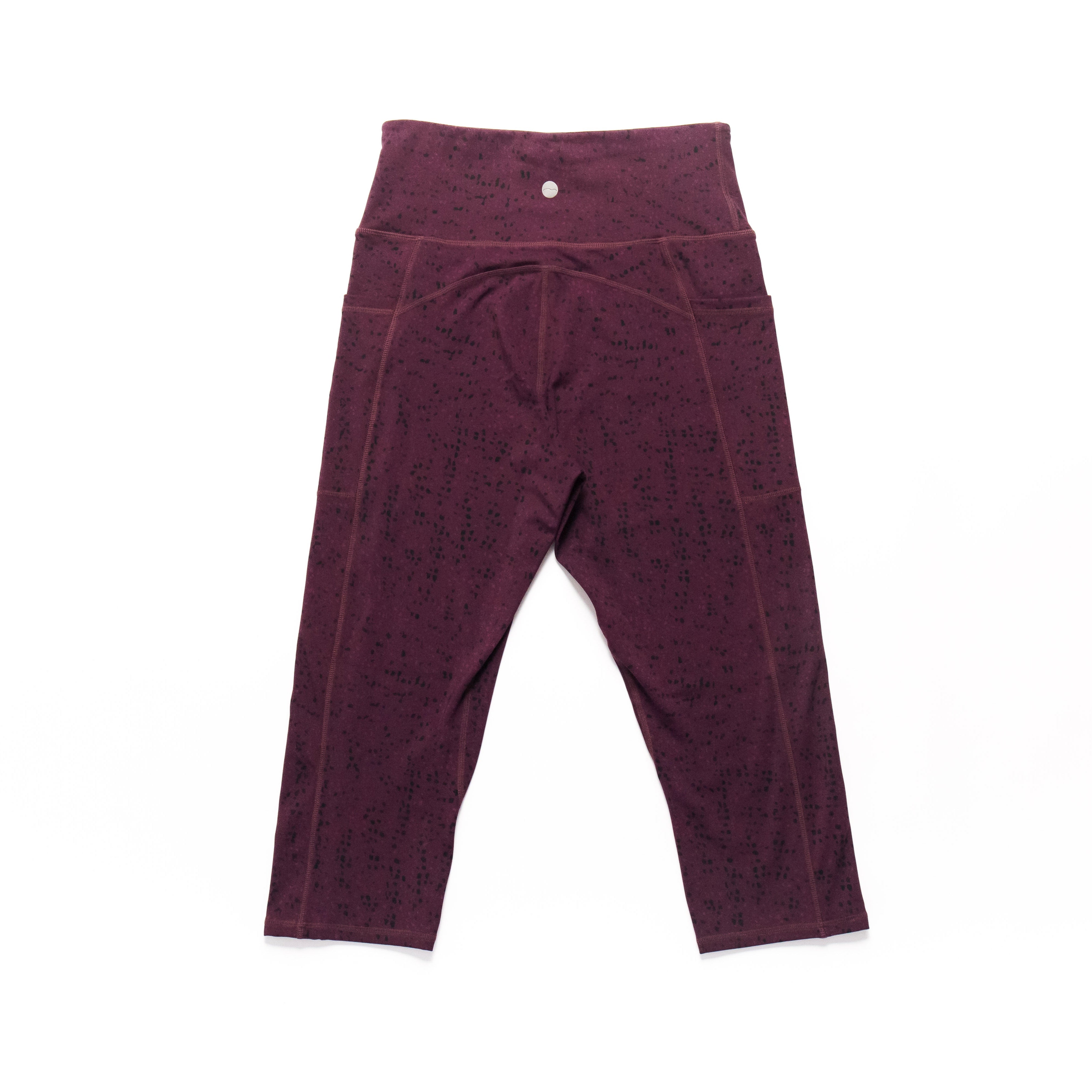 Maroon leggings on a white background