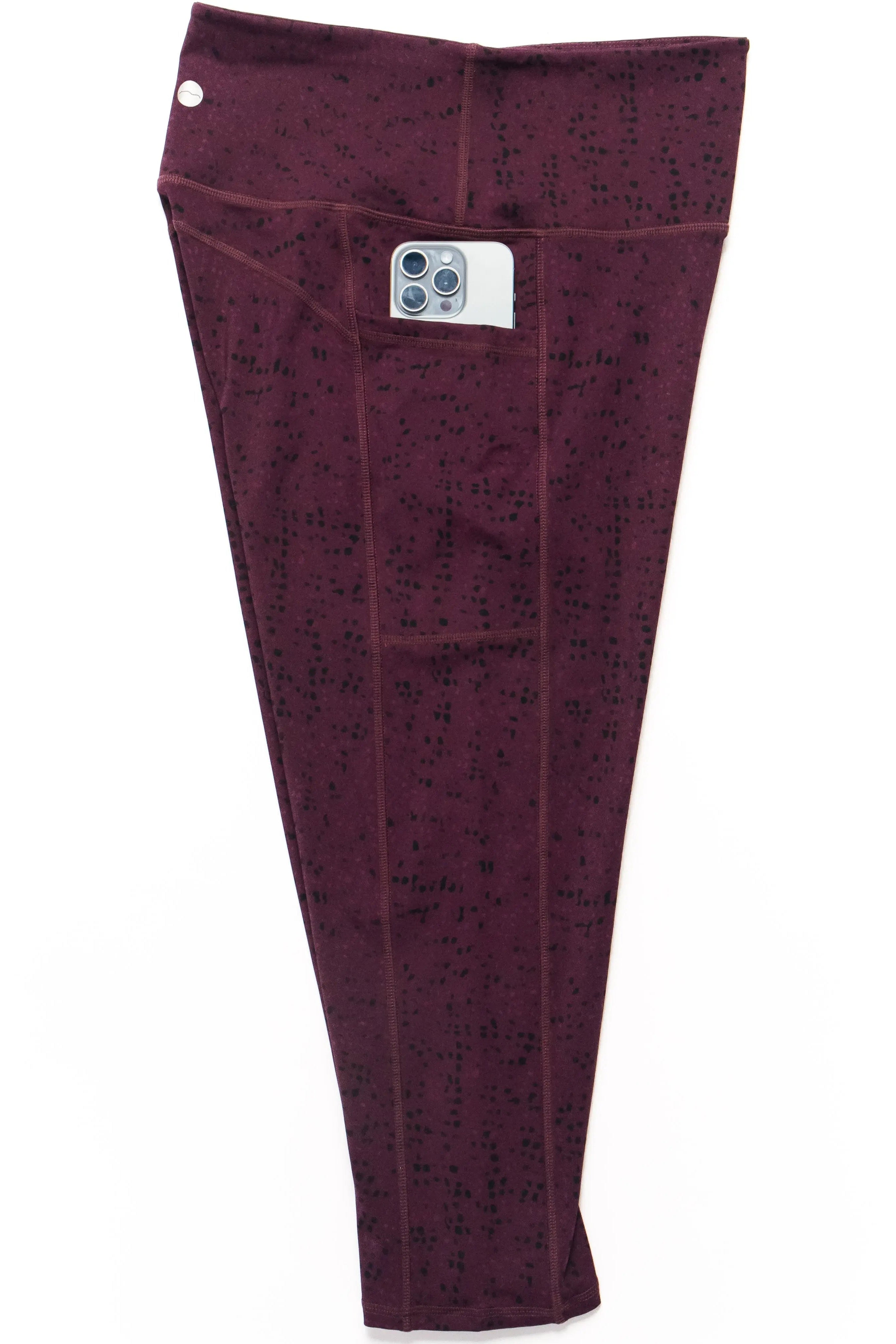 Maroon pants with a pattern on a white background